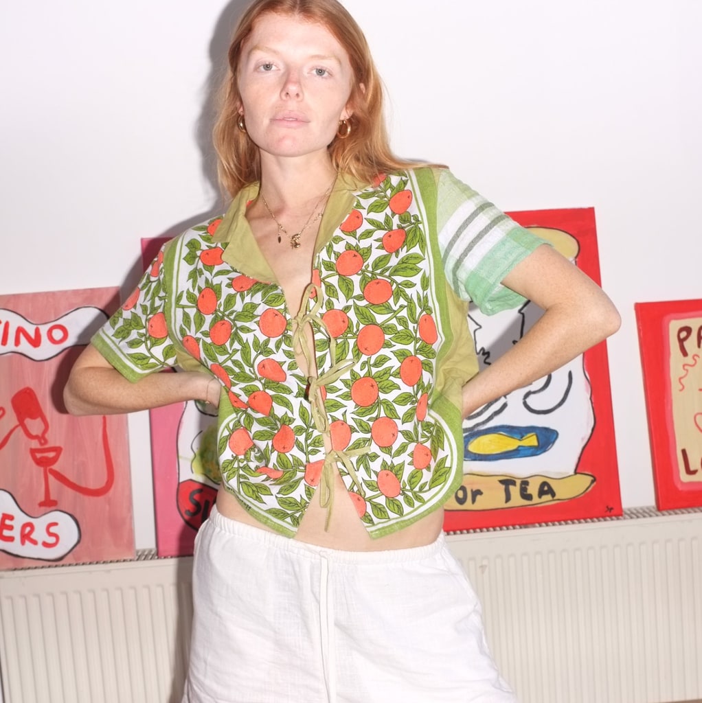model in orange printed shirt