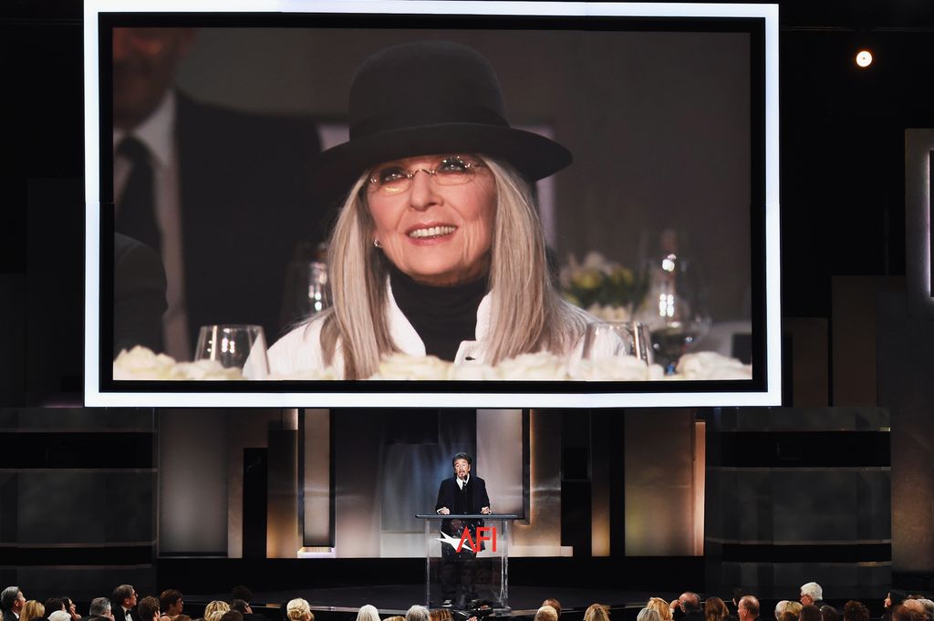 An image of honoree Diane Keaton is projected on a video screen while actor Al Pacino speaks onstage during American Film Institute's 45th Life Achievement Award Gala Tribute to Diane Keaton at Dolby Theatre on June 8, 2017 in Hollywood, California.
