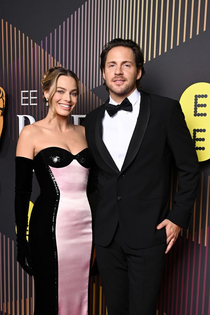 Margot Robbie and Tom Ackerley attend the 2024 EE BAFTA Film Awards at The Royal Festival Hall on February 18, 2024 in London, England.