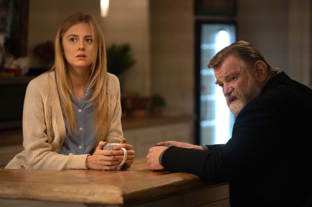 woman and man sitting in kitchen
