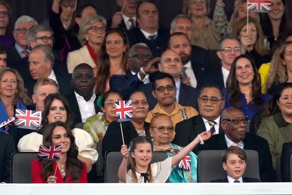 Princess Charlotte waves her flag during King Charles' coronation concert