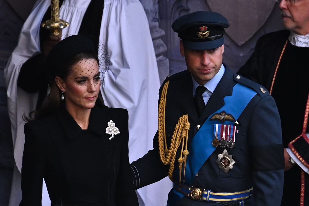 Kate Middleton in black dress with Prince William in military dress