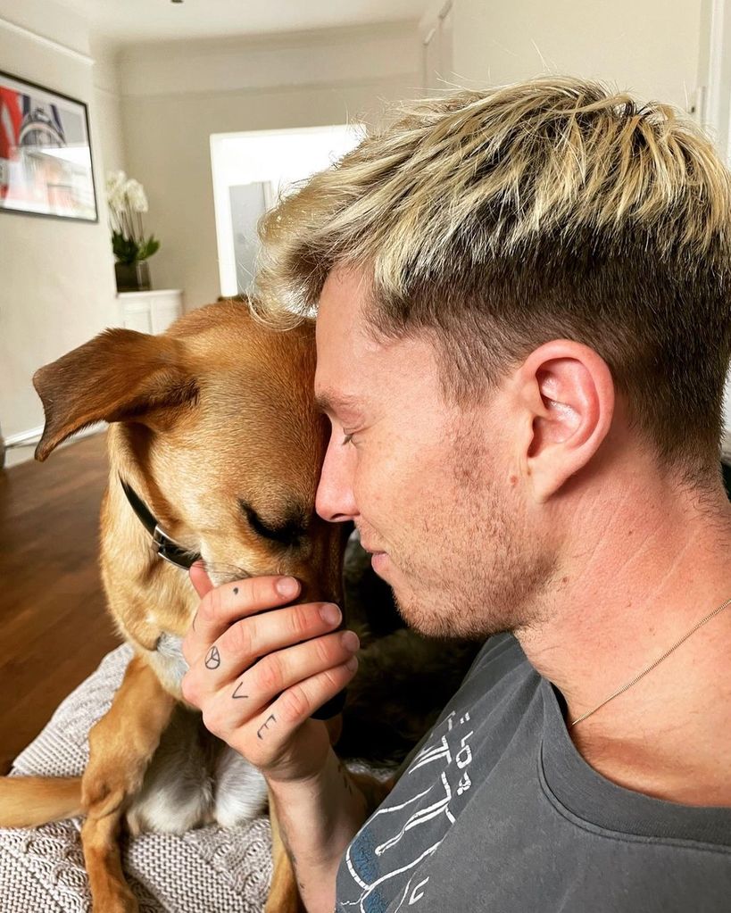 Jordan embracing pet dog 
