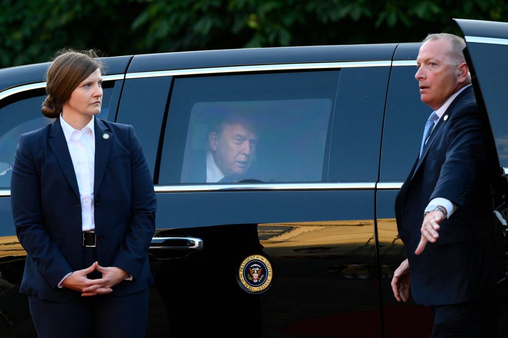 President Donald Trump sits in his car "The Beast" as he arrives  for a social dinner at the 'Huis ten Bosch' Royal Palace during a North Atlantic Treaty Organization