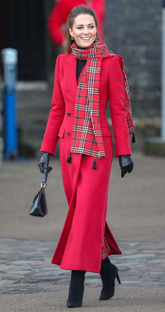 Kate Middleton wearing a red tartan scarf 