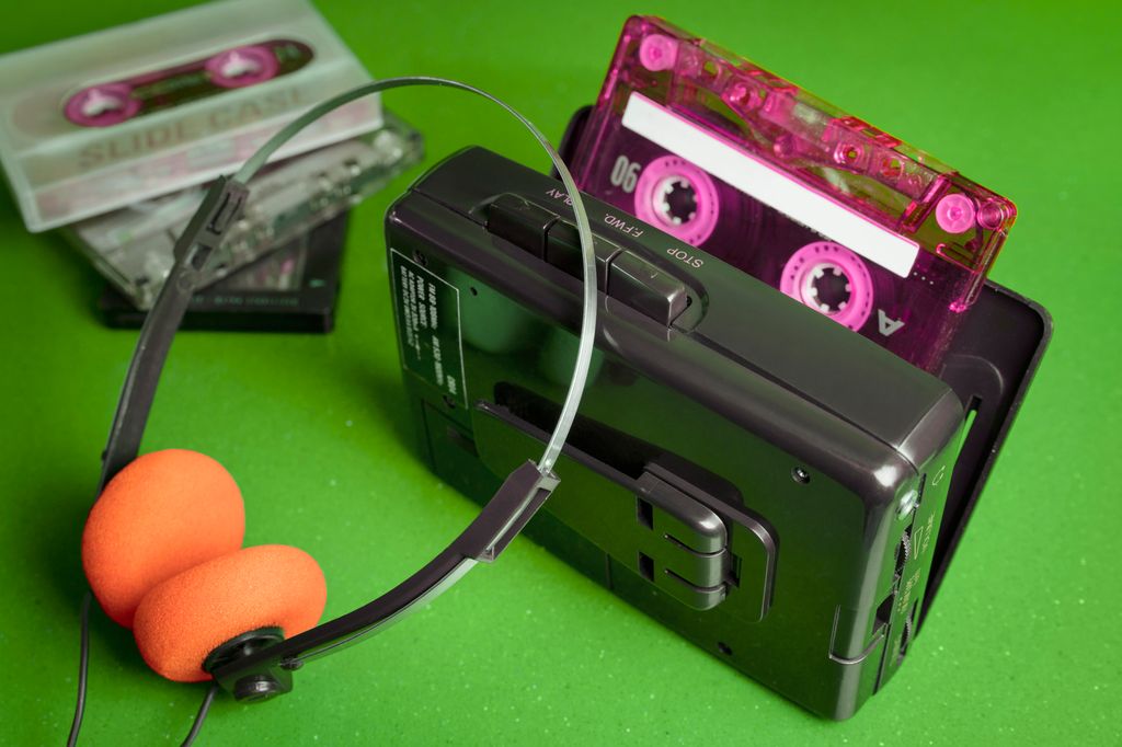 Cassette personal player music 80s with orange pads headphones