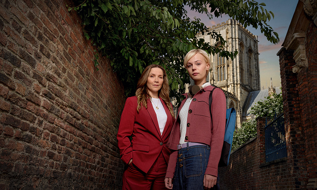two women standing outdoors