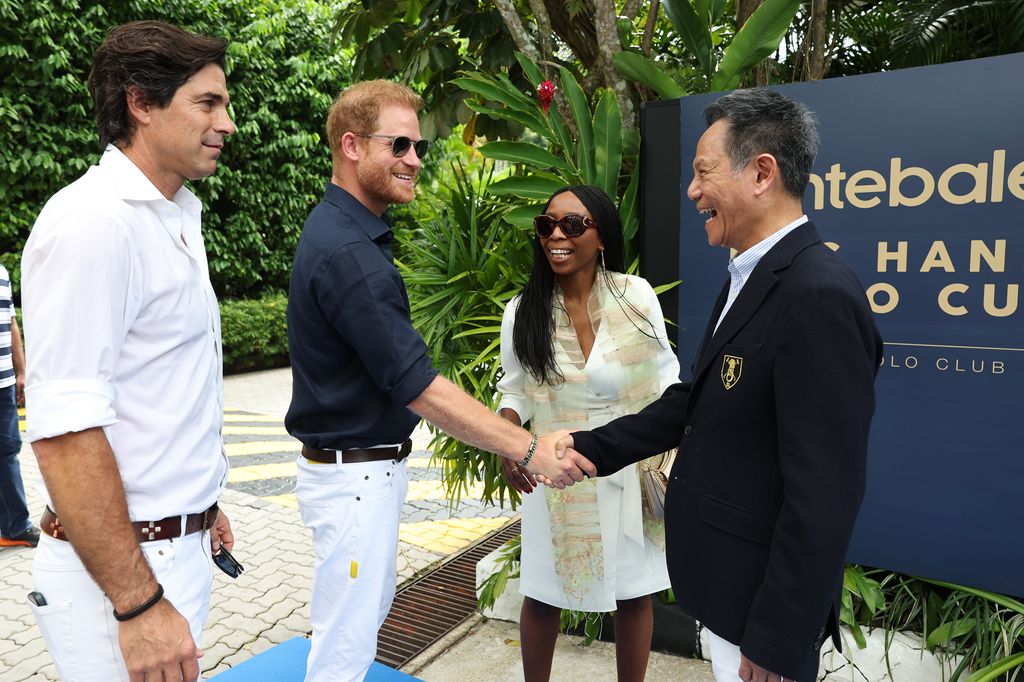 Prince Harry shaking hands with President of Singapore Polo Club