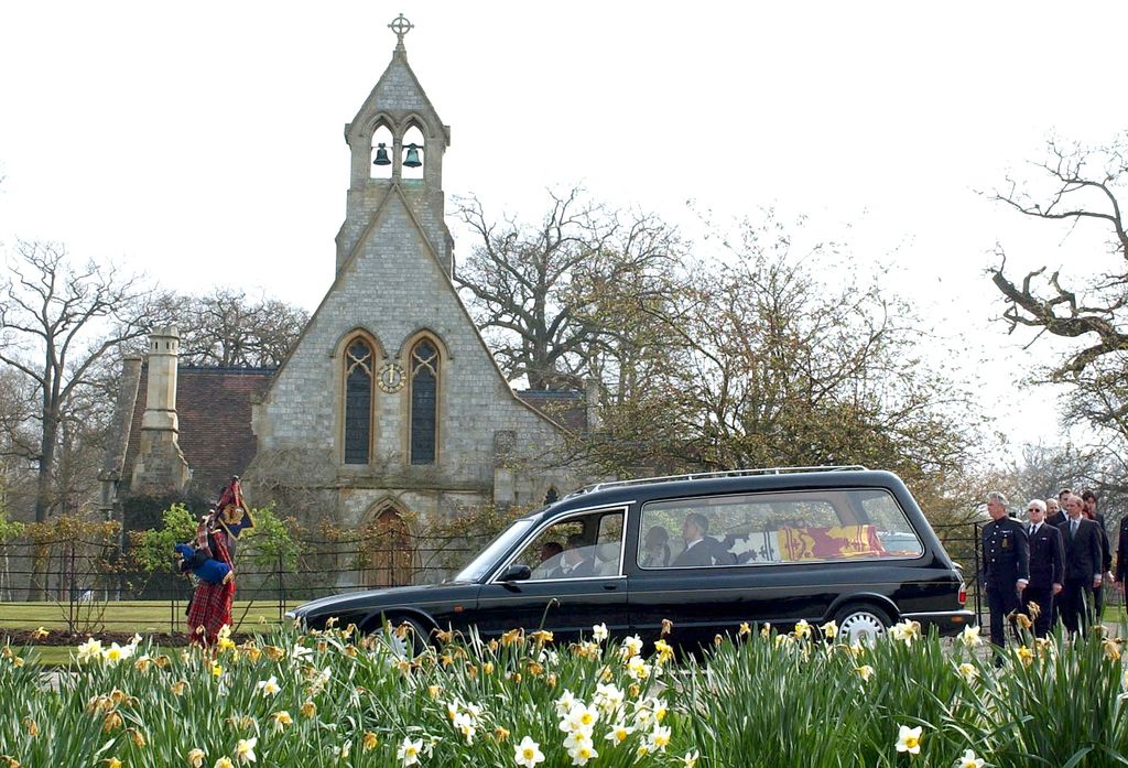 The Queen's Piper Jim Motherwell playing as the Queen Mother's Coffin is carried out of The Royal Chapel Of All Saints at Royal Lodge