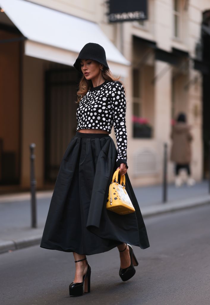Fashion Week guest wearing spotty top and wide circle skirt 