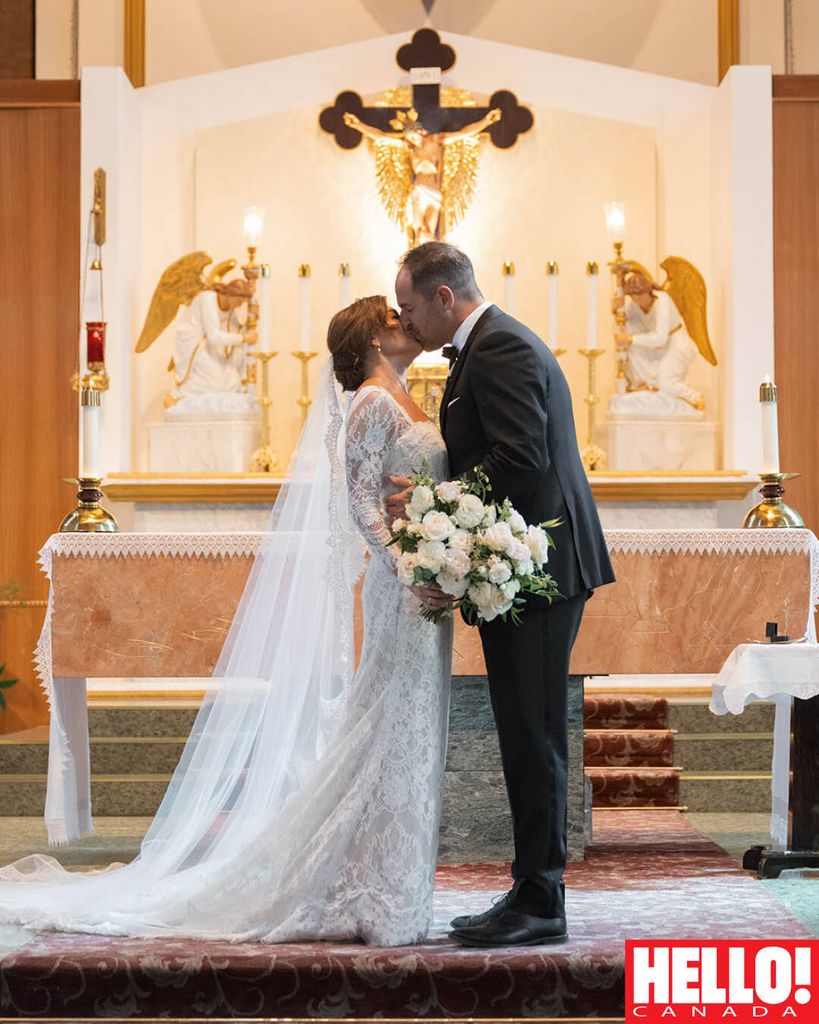 Sealed with a kiss! The couple exchanges vows in a traditional Catholic ceremony