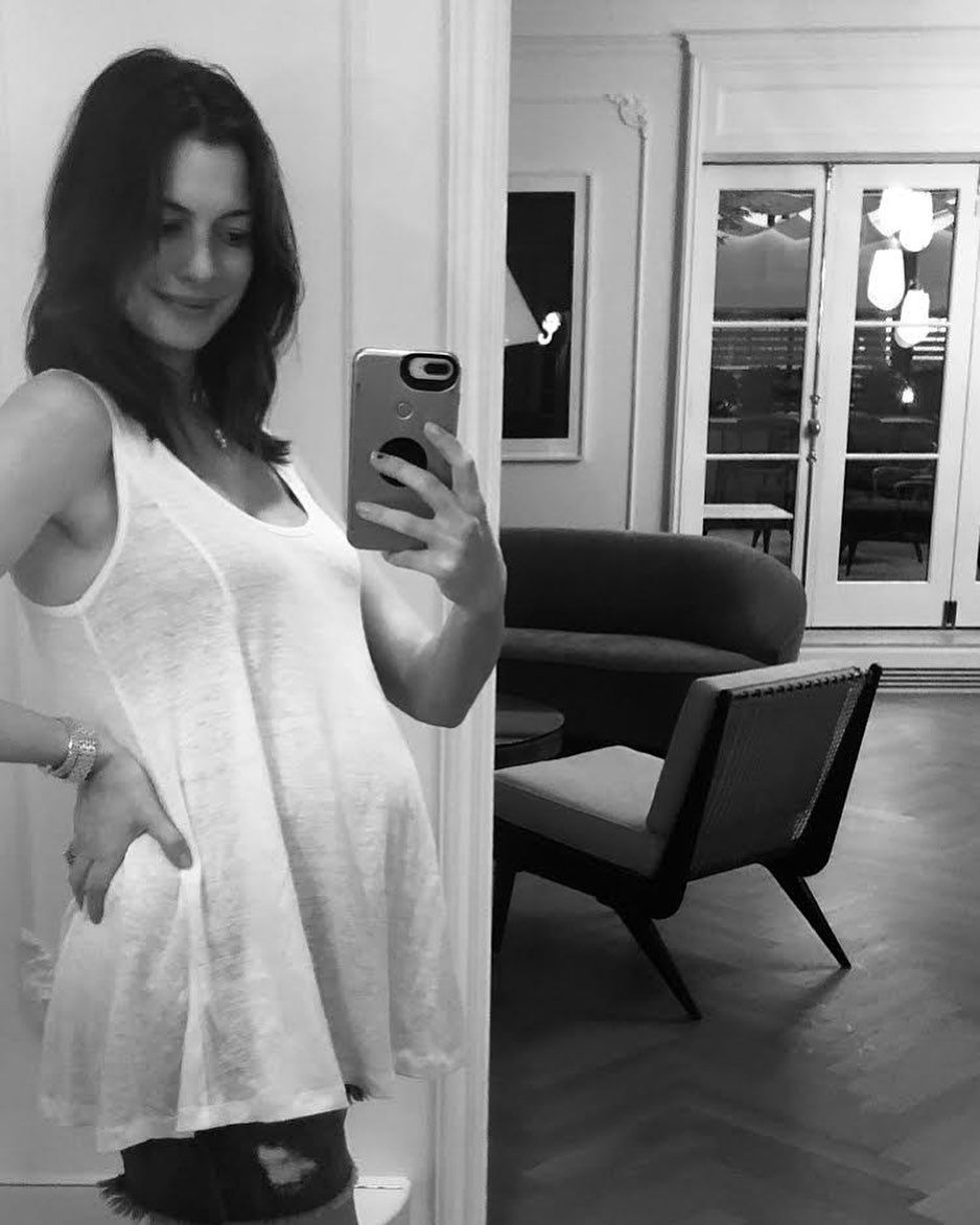 Anne Hathaway shows off her baby bump as she announces her second pregnancy