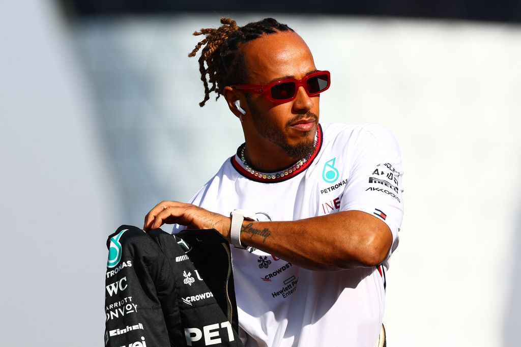 ABU DHABI, UNITED ARAB EMIRATES - NOVEMBER 26: Lewis Hamilton of Great Britain and Mercedes looks on from the drivers parade prior to the F1 Grand Prix of Abu Dhabi at Yas Marina Circuit on November 26, 2023 in Abu Dhabi, United Arab Emirates. (Photo by Mark Thompson/Getty Images)