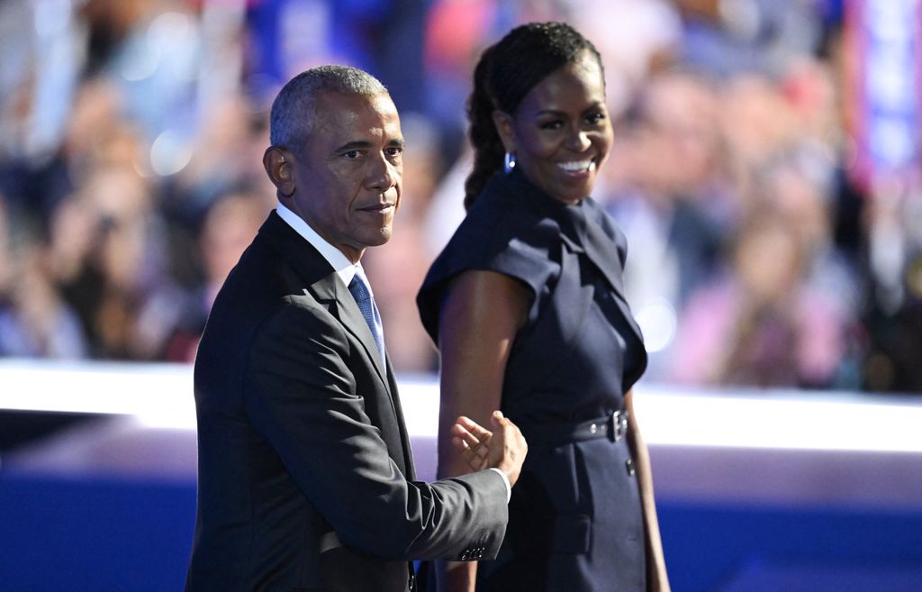 barack and michelle obama on stage