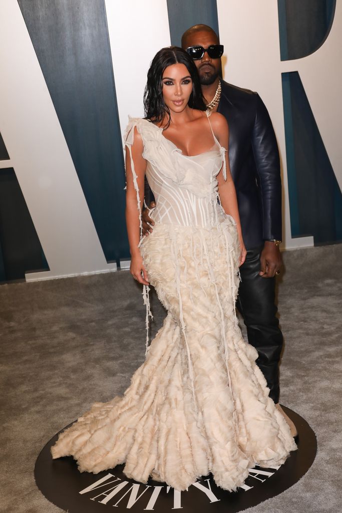 Kim Kardashian and Kanye West smouldering in a full-length photo