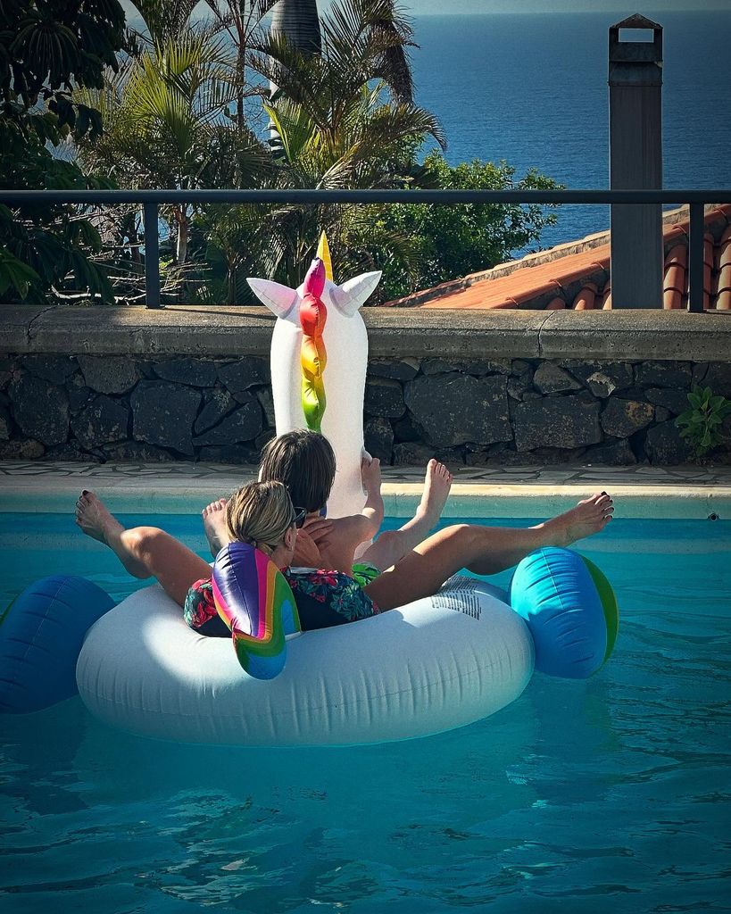 Suranne Jones with her son in a swimming pool