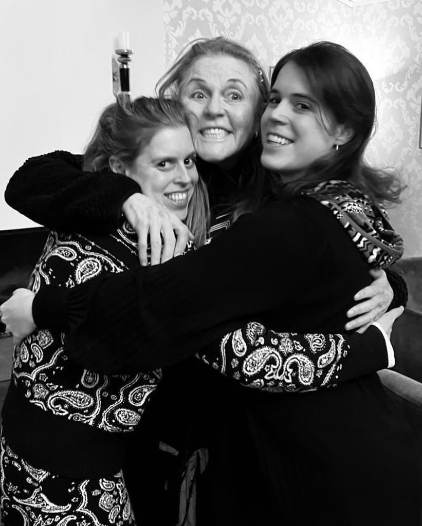 Beatrice and Eugenie hugging Duchess Sarah