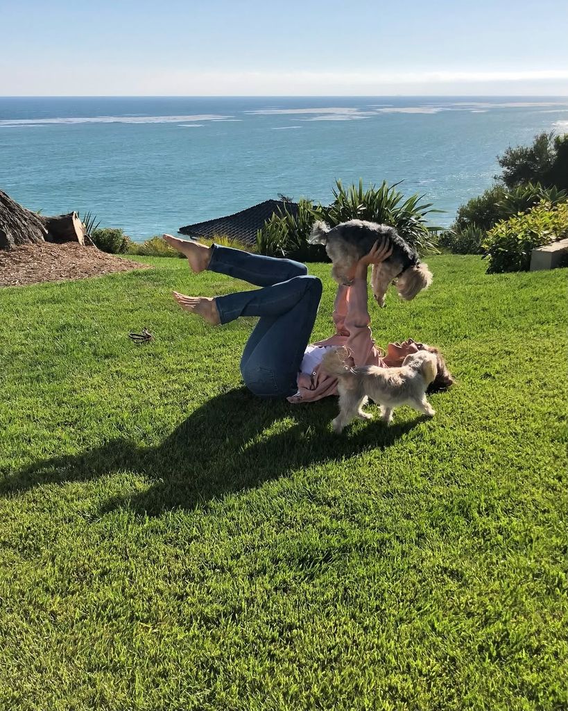 Photo of Cindy holding her dog