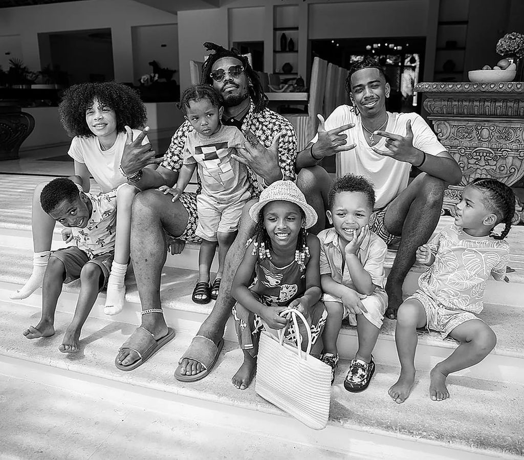 photo of cam newton and seven of his nine kids