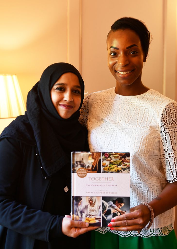 Zahira Ghaswala and Natalie Campbell of the Royal Foundation holds a copy of Together book