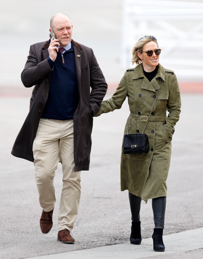 Zara and Mike Tindall walking together at Cheltenham Racecourse