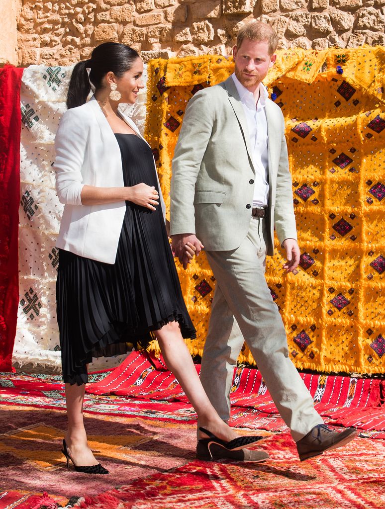  Prince Harry, Duke of Sussex and Meghan in black dress