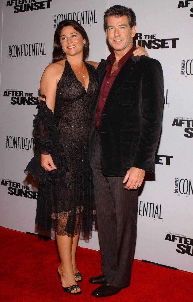 Kelly Shaye Smith standing with her arm around Pierce Brosnan