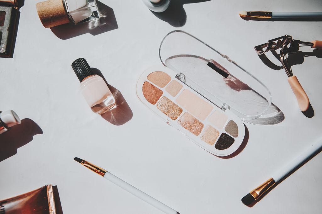 various makeup products and cosmetics in white background.Top view