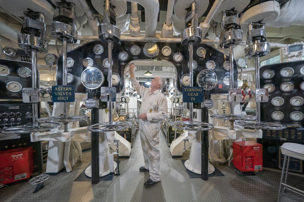 Workman in engine room on board Royal Yacht Britannia