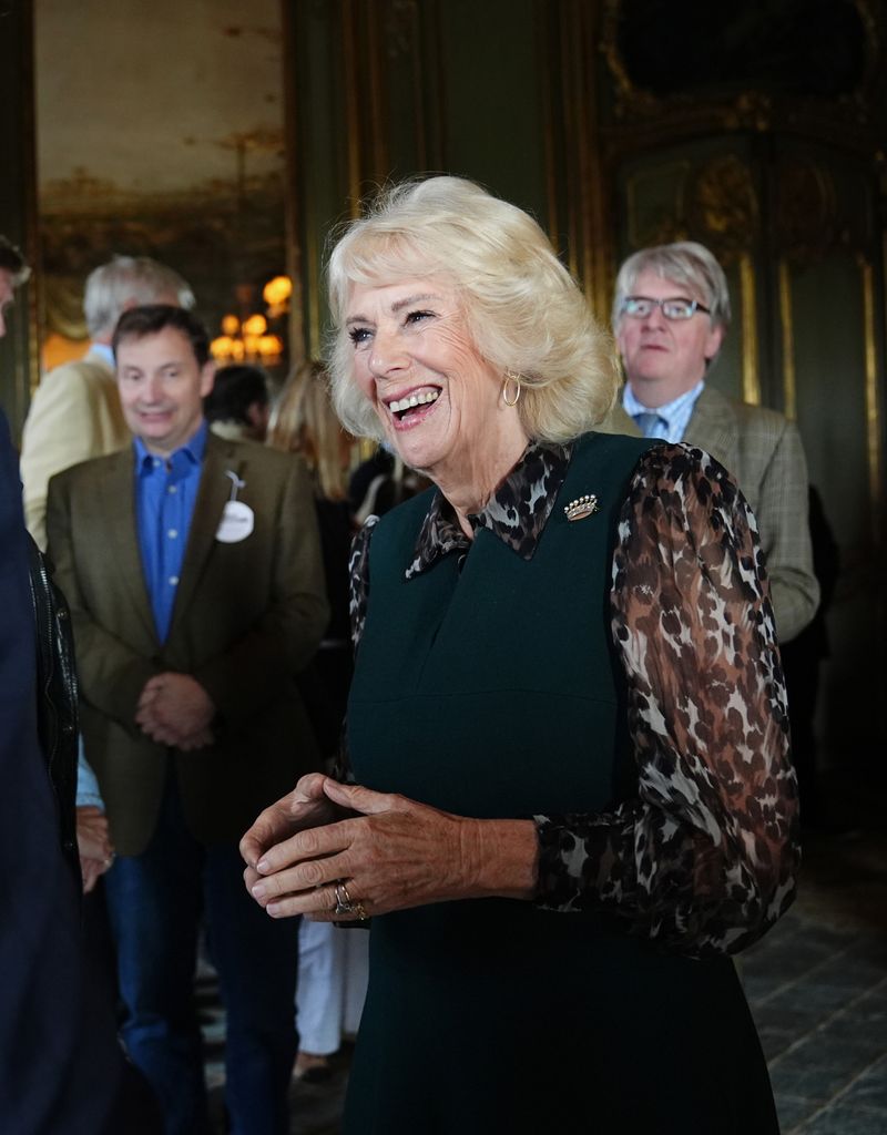 Camilla wore a dress featuring leopard-print sleeves to may tribute to her "much-missed" friend