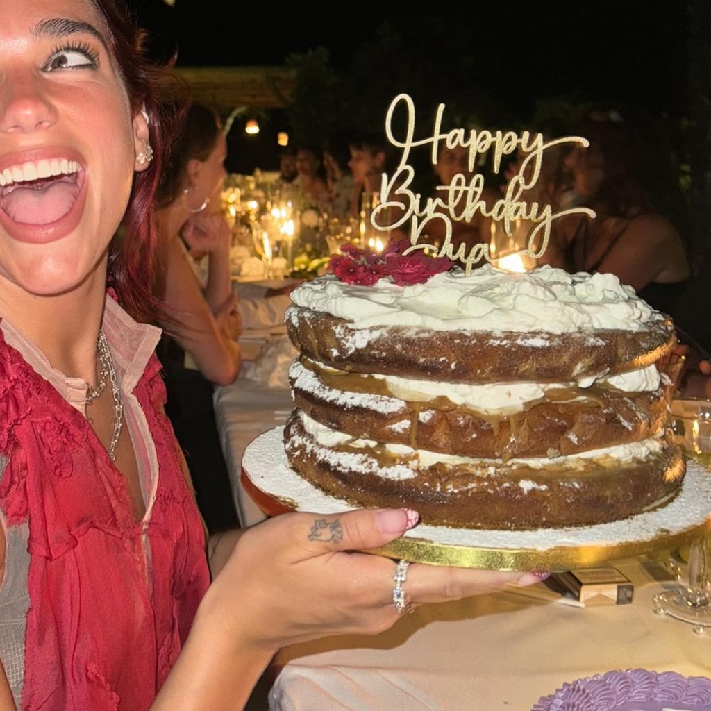 Dua posed with a birthday cake 