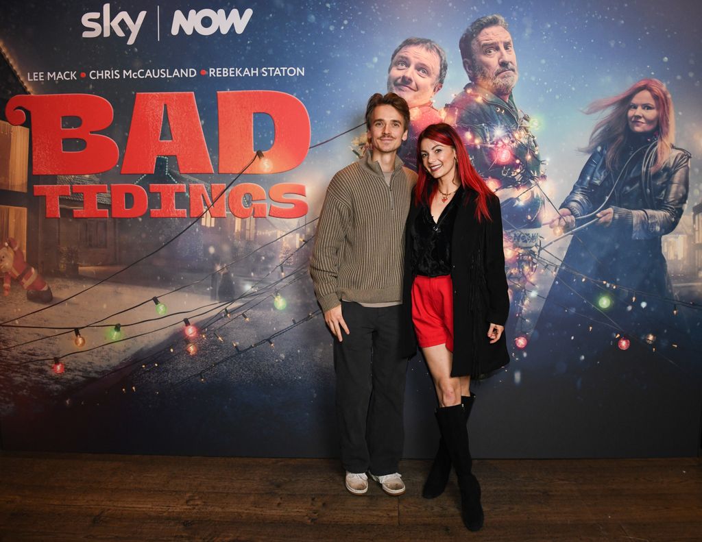 Joe Sugg and Dianne Buswell standing in front of a movie poster