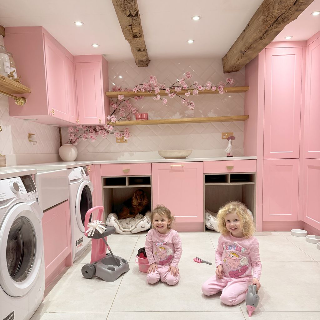 two girls in pink utility room