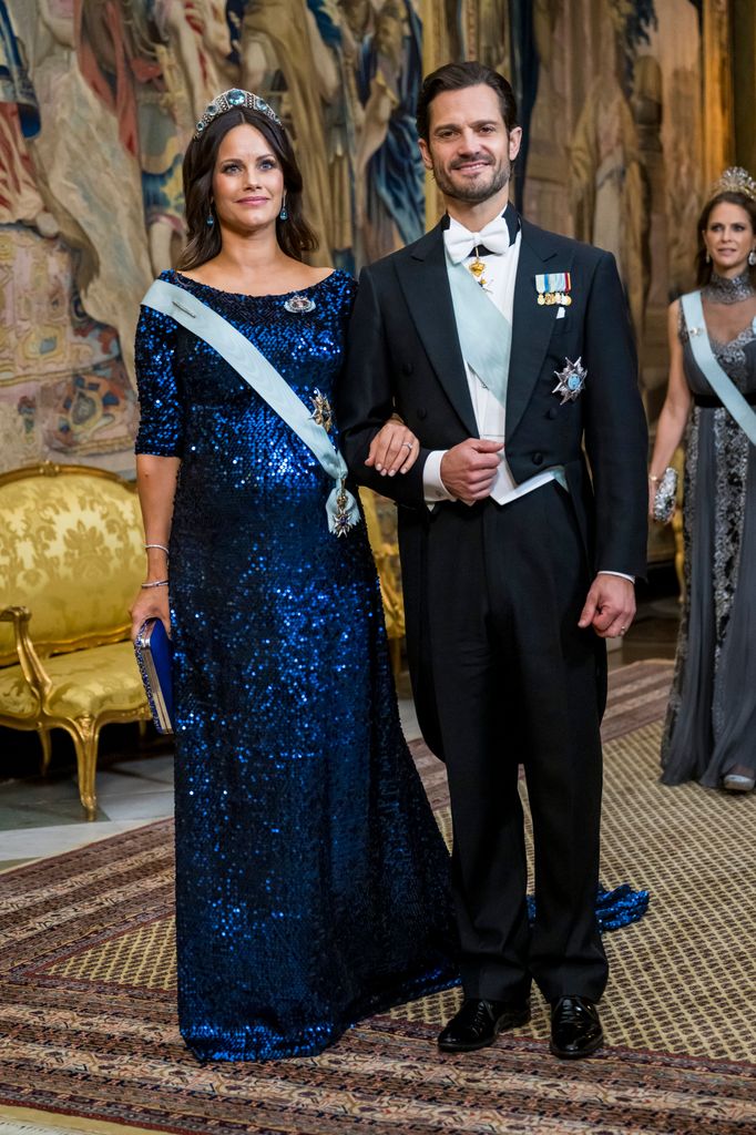 Princess Sofia in blue sequin dress and tiara with Prince Carl Philip