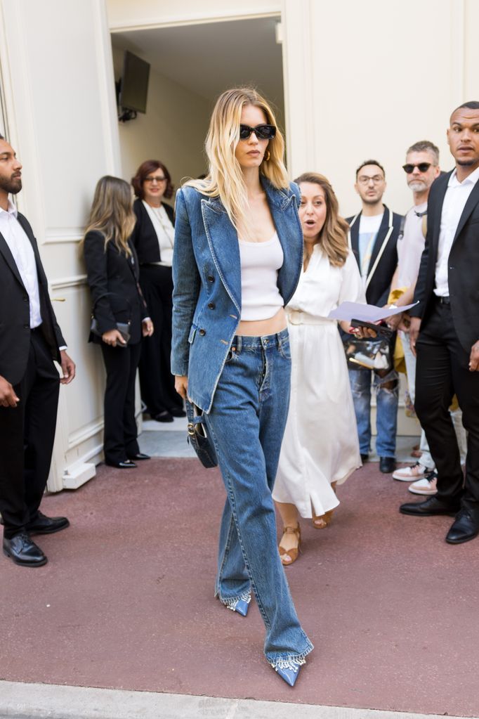 Abbey Lee Kershaw is seen at The Carlton Hotel during the 77th Cannes Film Festival in jeans and a denim blazer