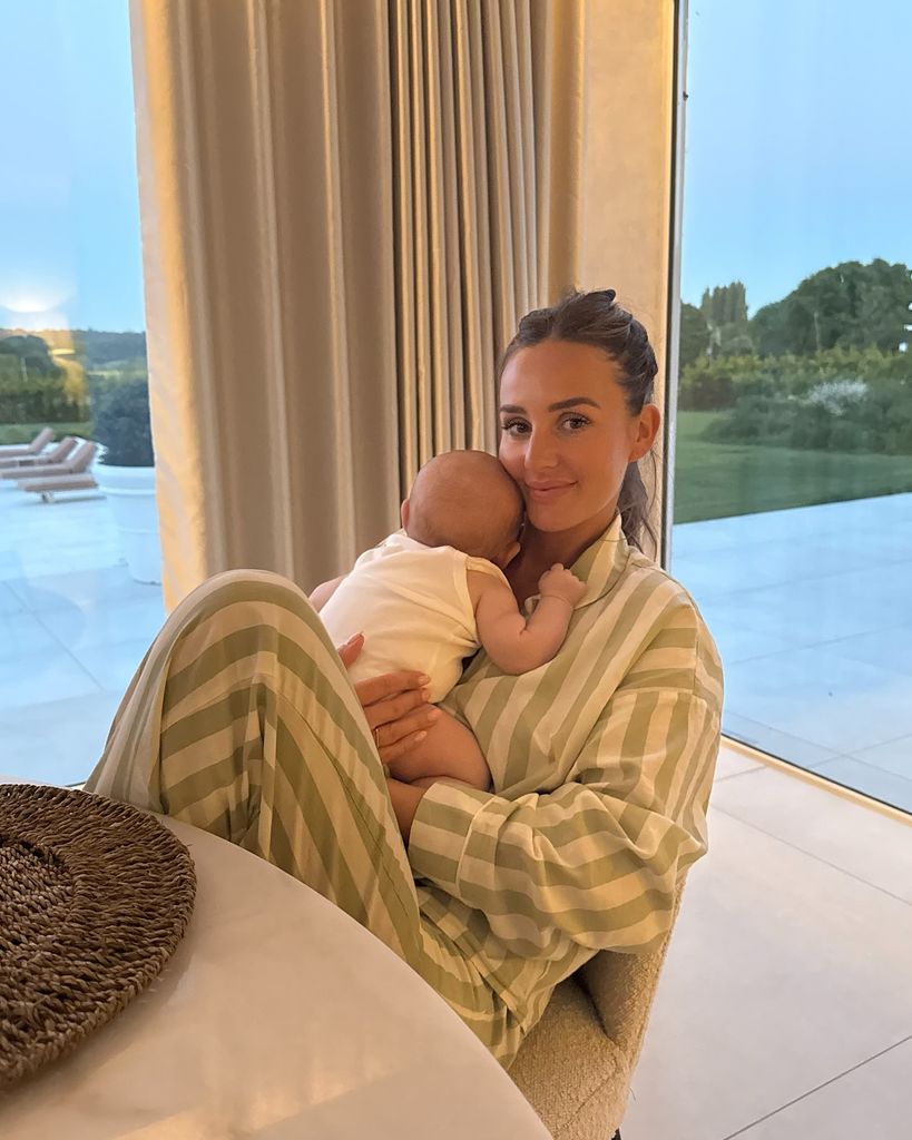 Katie cuddled up to baby Palma, who was sweet in white