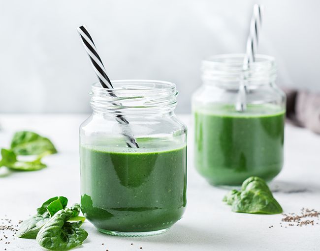 green juice served in jars with straws