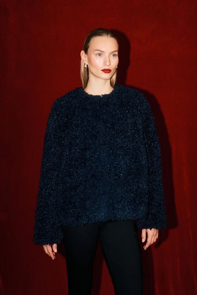 model in navy borg jacket 