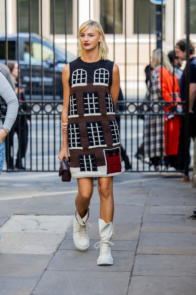 Mia Regan wears dres with graphic outside JW Anderson during London Fashion Week September 2024 on September 15, 2024 in London, England