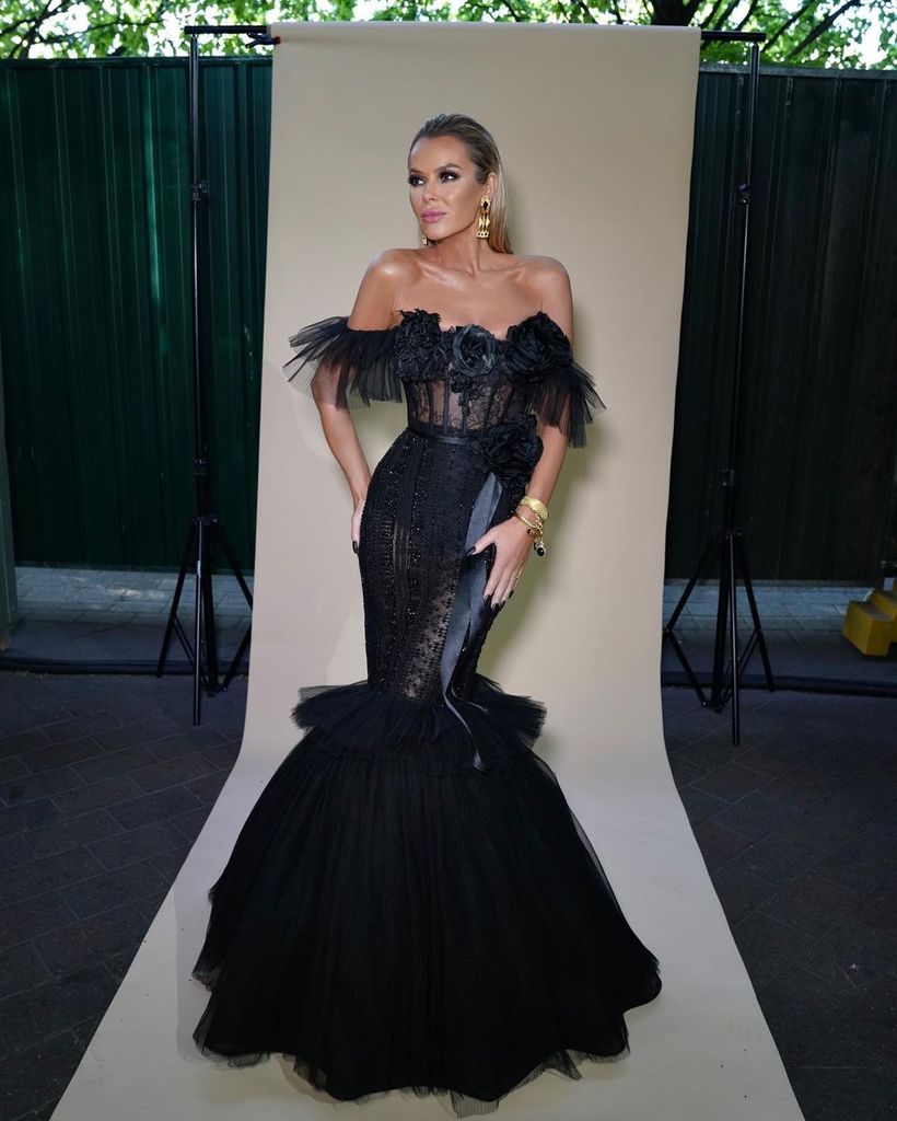 amanda holden posing in black sheer gown 