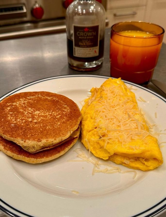 A plate with pancakes and an omlette