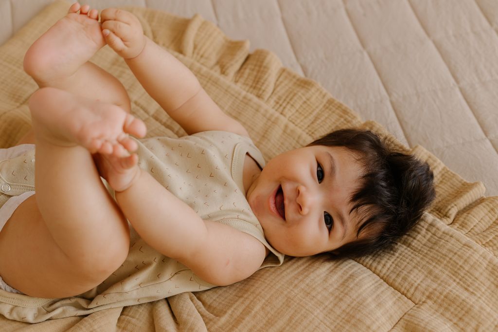 baby girl on rug
