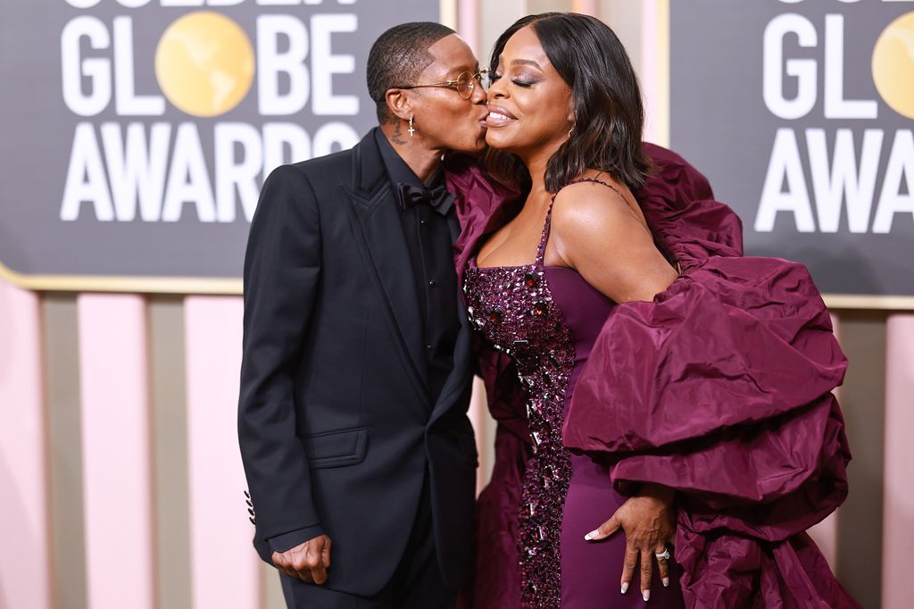 Niecy Nash gets a kiss from wife Jessica Betts at the Golden Globe Awards