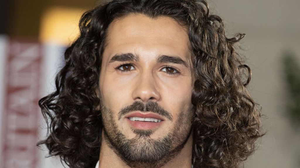 Graziano Di Prima with long curly hair. 