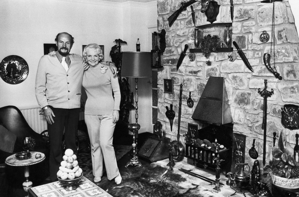 The parents of Tom Jones standing in his childhood home living room in 1976