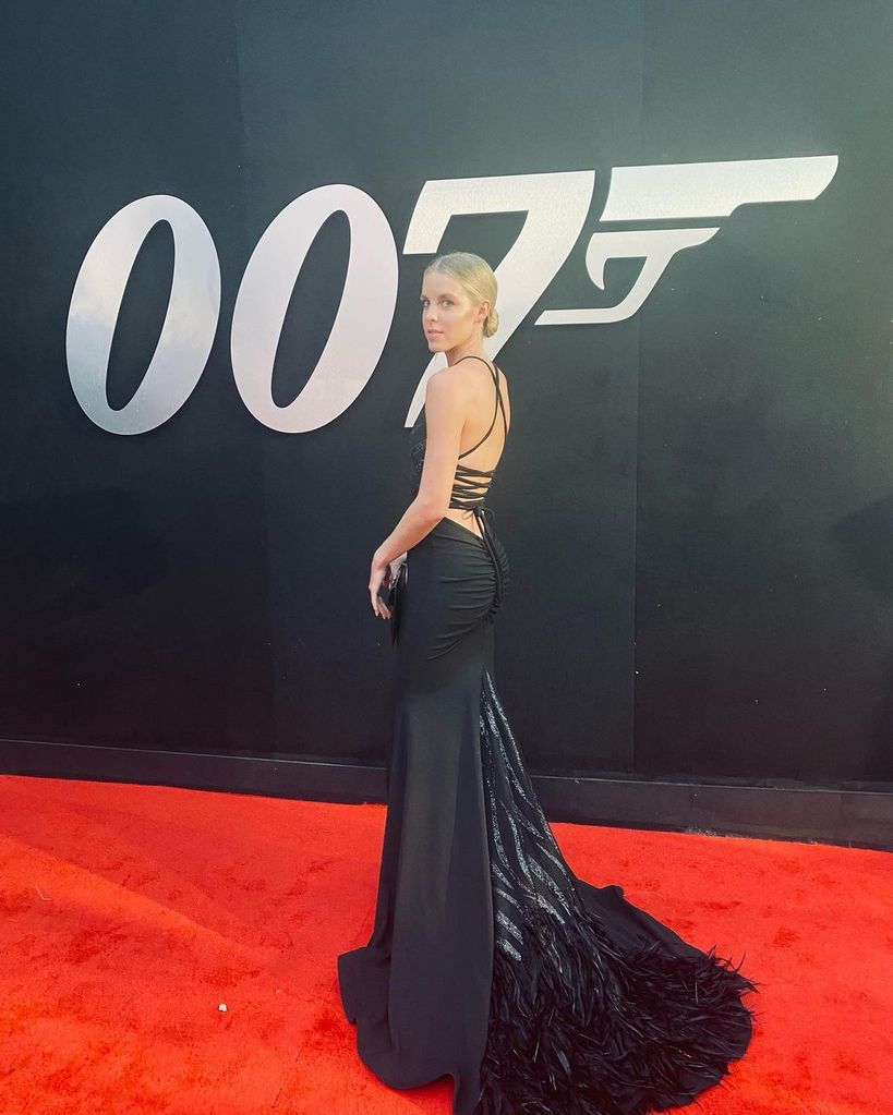 Keely Hodkginson wears a black dress at the premiere of 007: No Time To Die