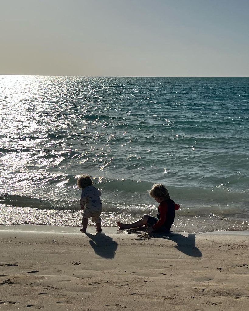two children playing at the beach