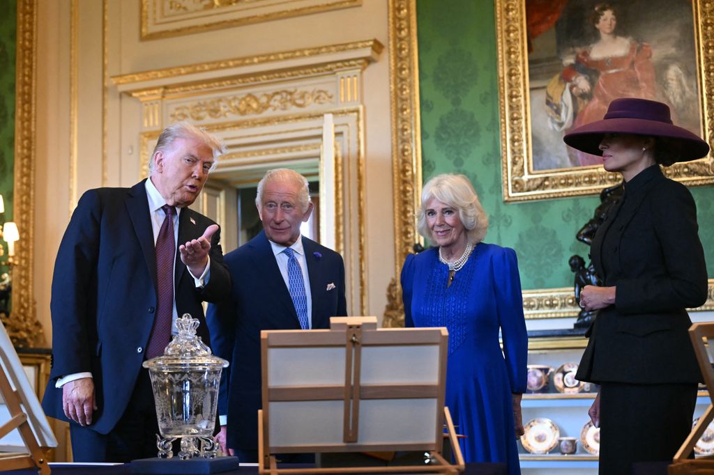 US President Donald Trump, King Charles, Queen Camilla and US First Lady Melania Trump view items from the Royal Collection in the Green Drawing Room at Windsor Castle