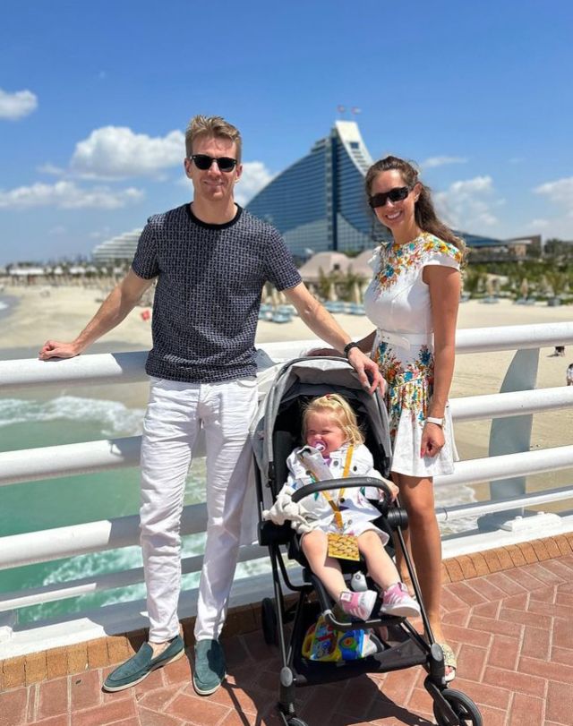 Nico Hulkenberg with wife and daughter on the beach