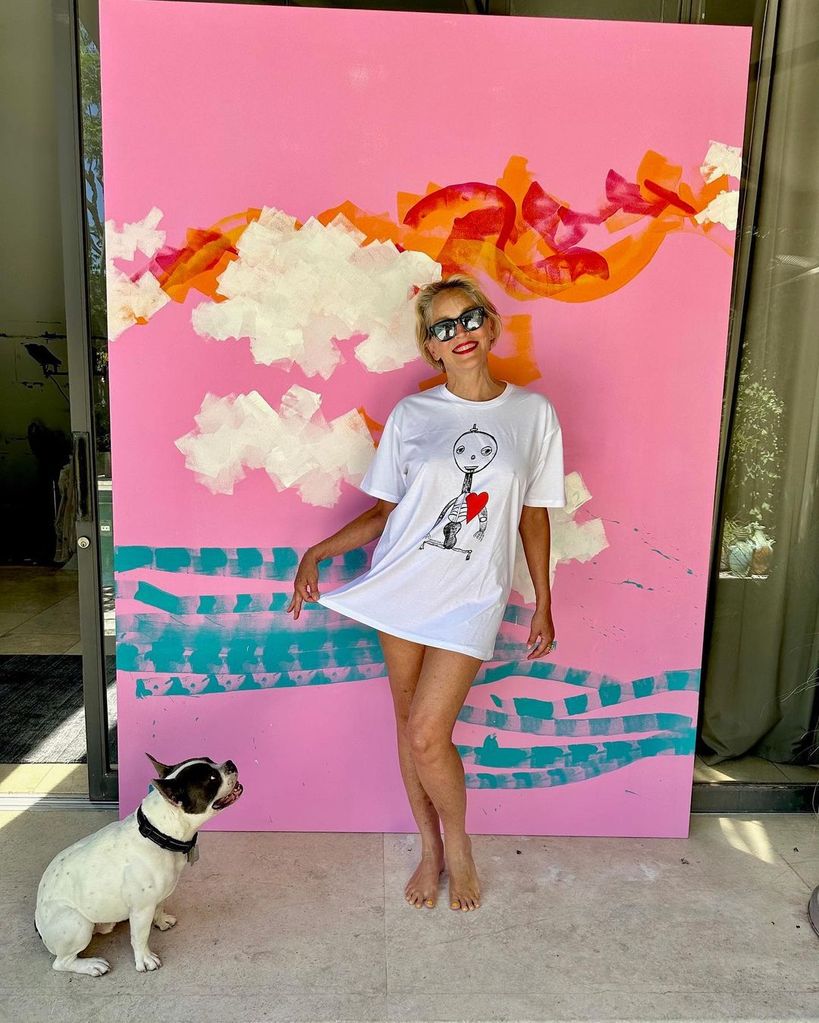 Sharon Stone posing in front of one of her paintings in a photo shared on Instagram